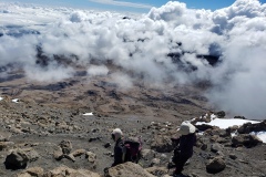 Kathy-and-Passot-heading-down-kili20200114_1001330